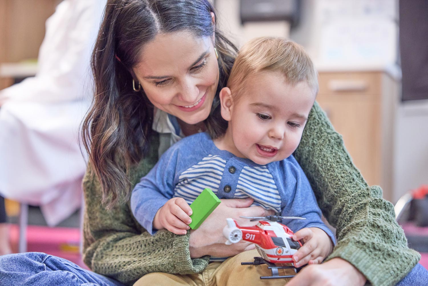 Mom holding a toddler